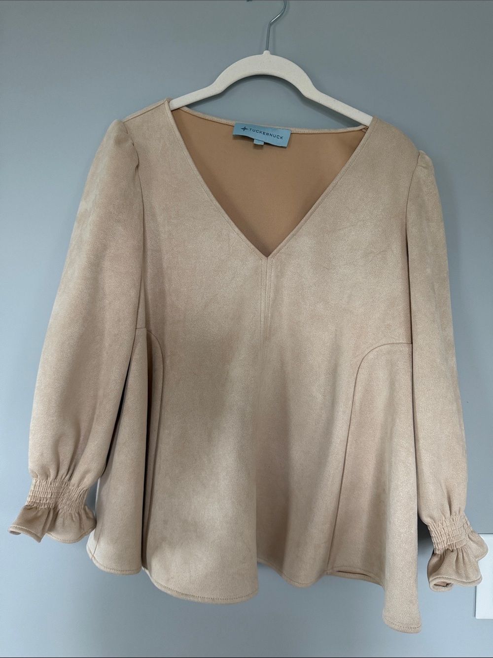 Tuckernuck Cream V‑Neck Peplum Blouse